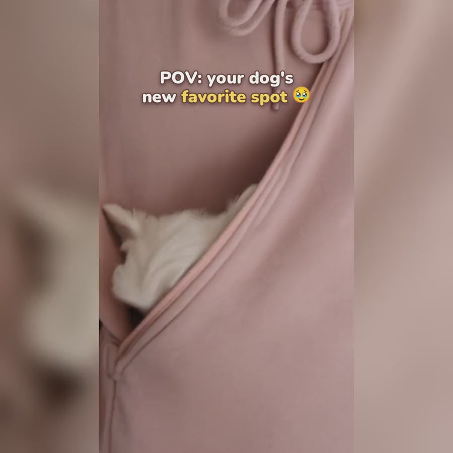 Pink pet pouch hoodie with a Maltese in the pouch